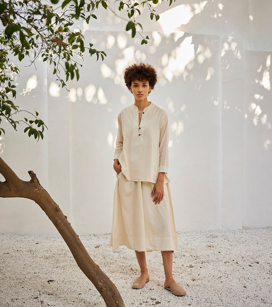 Moonlight co-ord set at Kamakhyaa by Khara Kapas. This item is Casual Wear, Co-ord Sets, Lounge Wear Co-ords, Mul Cotton, Off-White, Oh! Sussana Spring 2023, Organic, Regular Fit, Skirt Sets, Solids, Vacation Co-ords, Womenswear