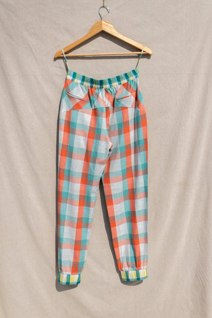 Multicolor Jogger Pants at Kamakhyaa by Anushé Pirani. This item is Casual Wear, Checks, Fitted At Waist, Handwoven Cotton, Joggers, July Sale, July Sale 2023, Multicolor, Natural, Of Myriad Minds, Office Wear, Playful Office Wear, sale anushe pirani, Womenswear