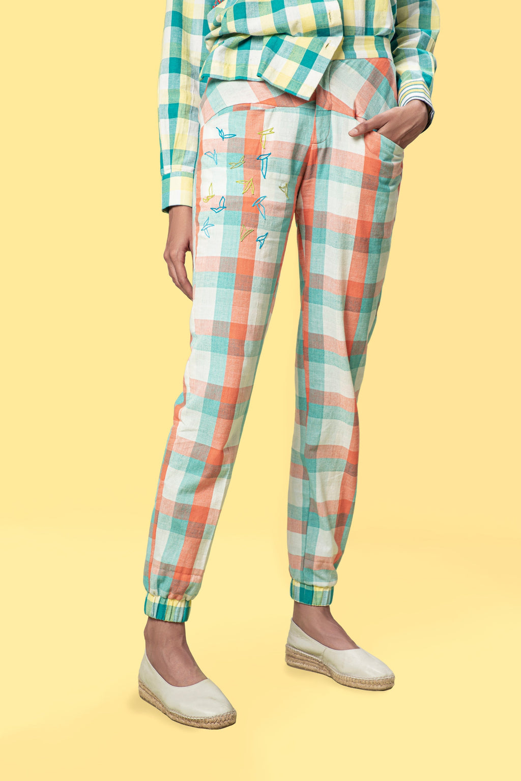 Multicolor Jogger Pants at Kamakhyaa by Anushé Pirani. This item is Casual Wear, Checks, Fitted At Waist, Handwoven Cotton, Joggers, July Sale, July Sale 2023, Multicolor, Natural, Of Myriad Minds, Office Wear, Playful Office Wear, sale anushe pirani, Womenswear