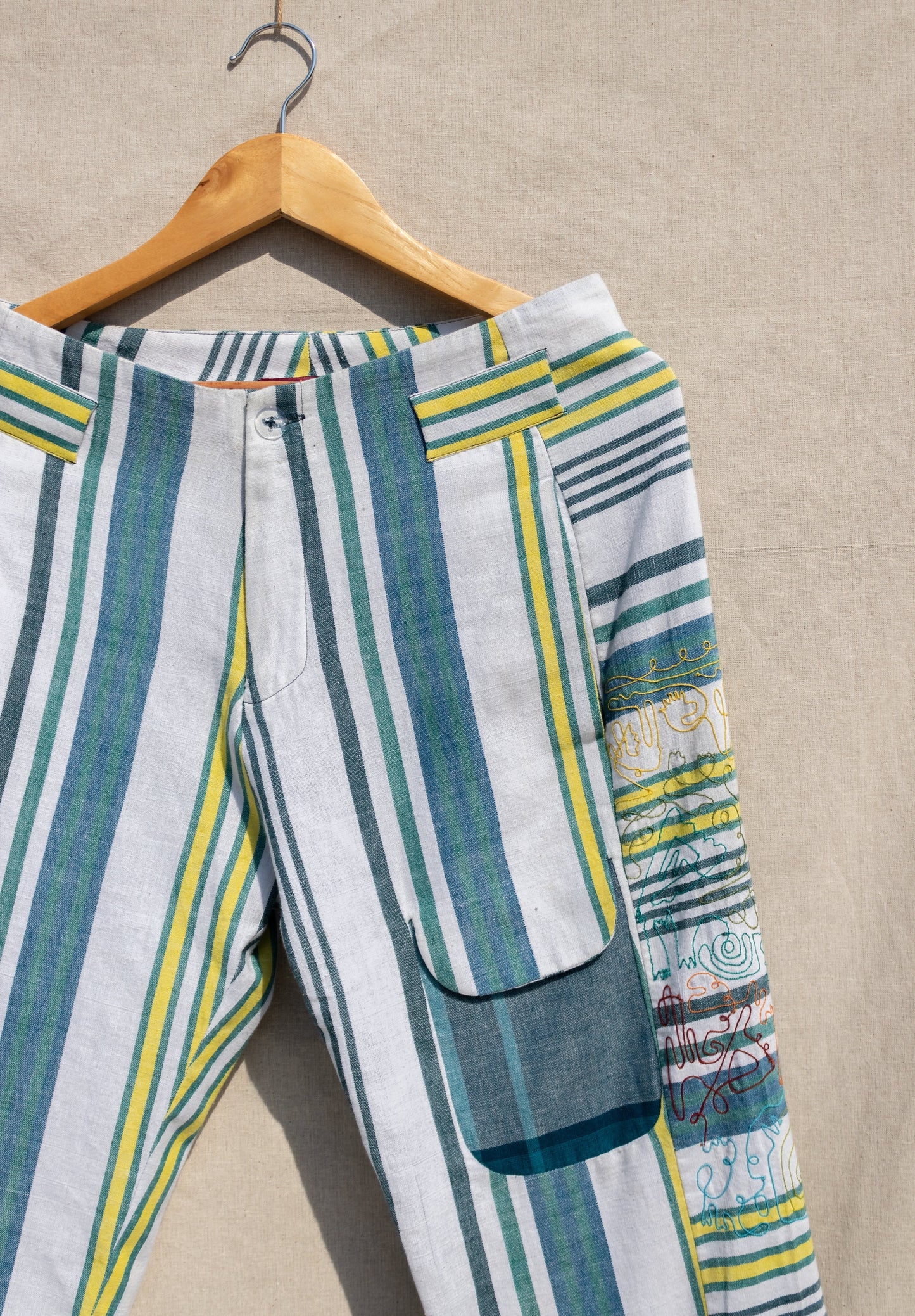 Multicolor Striped Pants at Kamakhyaa by Anushé Pirani. This item is Fitted At Waist, Handwoven Cotton, July Sale, July Sale 2023, Multicolor, Natural, Of Myriad Minds, Office Wear, Playful Office Wear, sale anushe pirani, Stripes, Trousers, Womenswear