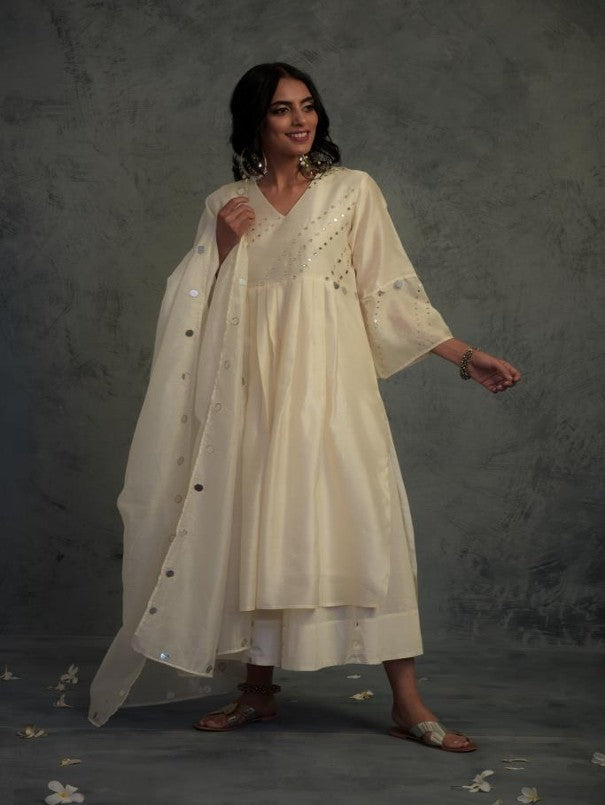 Off-white Bell Sleeves Kurta Set at Kamakhyaa by Charkhee. This item is Chanderi, Cotton, Embellished, Ethnic Wear, Indian Wear, Kurta Palazzo Sets, Kurta Set With Dupatta, Mirror Work, Natural, Relaxed Fit, Tyohaar, White, Womenswear