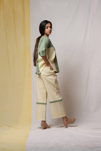 Off-white Bliss Of Life Trousers at Kamakhyaa by Niraa. This item is Cotton khadi, Natural with azo dyes, Off-white, Office Wear, Regular Fit, Solids, Tales of rippling brooks, Trousers, Womenswear