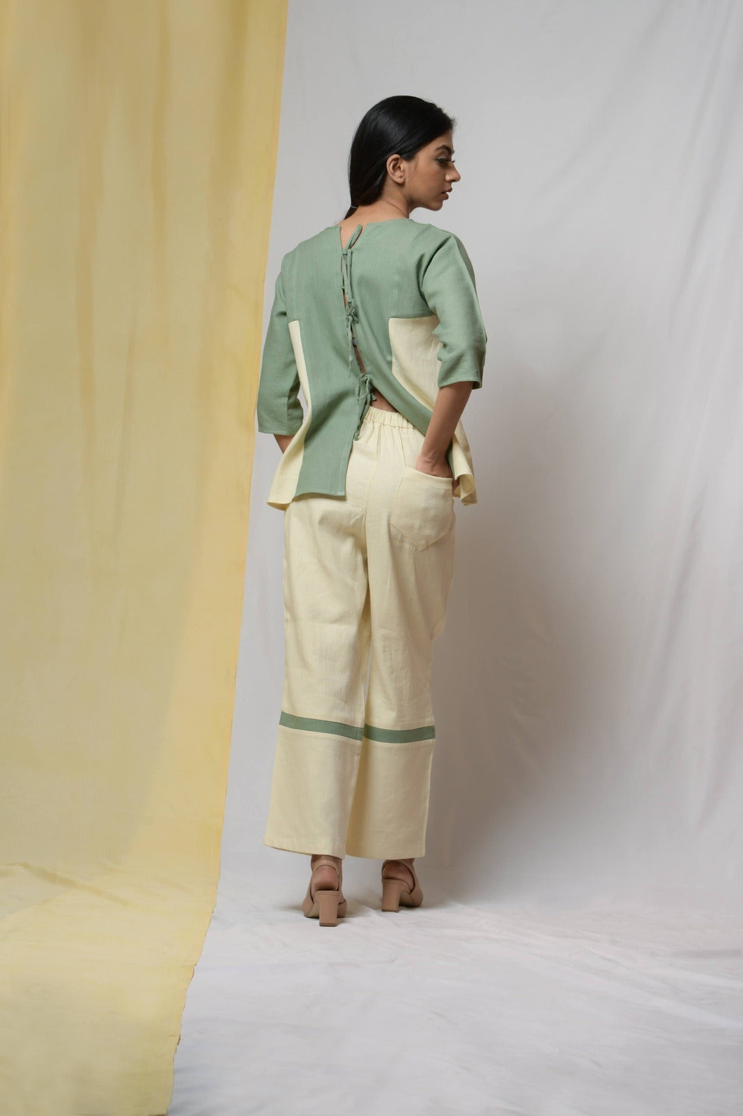 Off-white Bliss Of Life Trousers at Kamakhyaa by Niraa. This item is Cotton khadi, Natural with azo dyes, Off-white, Office Wear, Regular Fit, Solids, Tales of rippling brooks, Trousers, Womenswear