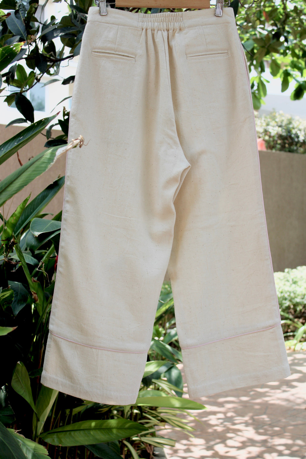 Off-white Pants at Kamakhyaa by Itya. This item is Hand Spun Cotton, Handwoven cotton, Natural, Off-white, Office Wear, Pants, Pastel Perfect, Pastel Perfect by Itya, Plant Dye, Relaxed Fit, Solids, SS22, Womenswear
