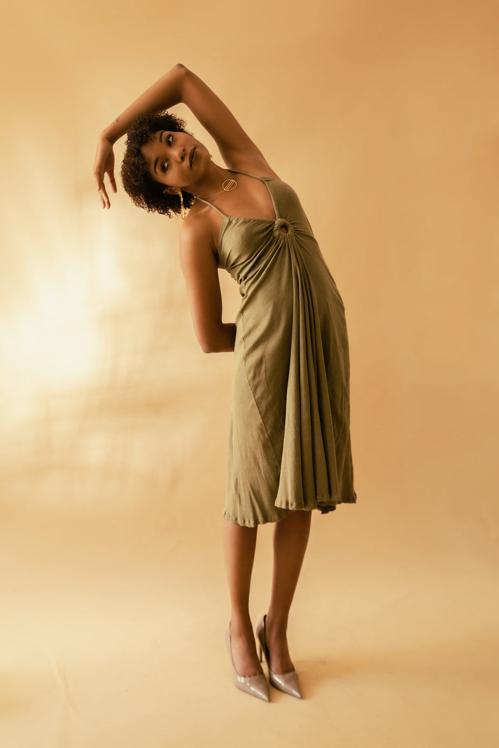 Olive Green Cotton Midi Dress at Kamakhyaa by Meko Studio. This item is Cotton, Deadstock Fabrics, Evening Wear, July Sale, July Sale 2023, Lycra, Midi Dresses, Regular Fit, Sleeveless Dresses, Solids, Strap Dresses, Verao SS-22/23, Womenswear