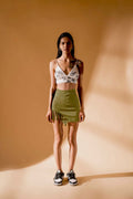 Olive Green Skirt at Kamakhyaa by Meko Studio. This item is Cotton, Deadstock Fabrics, Evening Wear, July Sale, July Sale 2023, Lycra, Mini Skirts, Olive Green, Skirts, Slim Fit, Solids, Verao SS-22/23, Womenswear