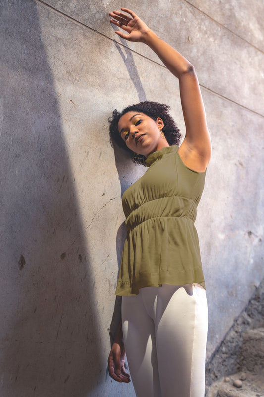 Olive Green Sleeveless Top at Kamakhyaa by Meko Studio. This item is Cotton, Deadstock Fabrics, Evening Wear, High Neck Tops, July Sale, July Sale 2023, Lycra, Olive Green, Relaxed Fit, Sleeveless Tops, Solids, Tops, Turtle Neck Tops, Verao SS-22/23, Womenswear