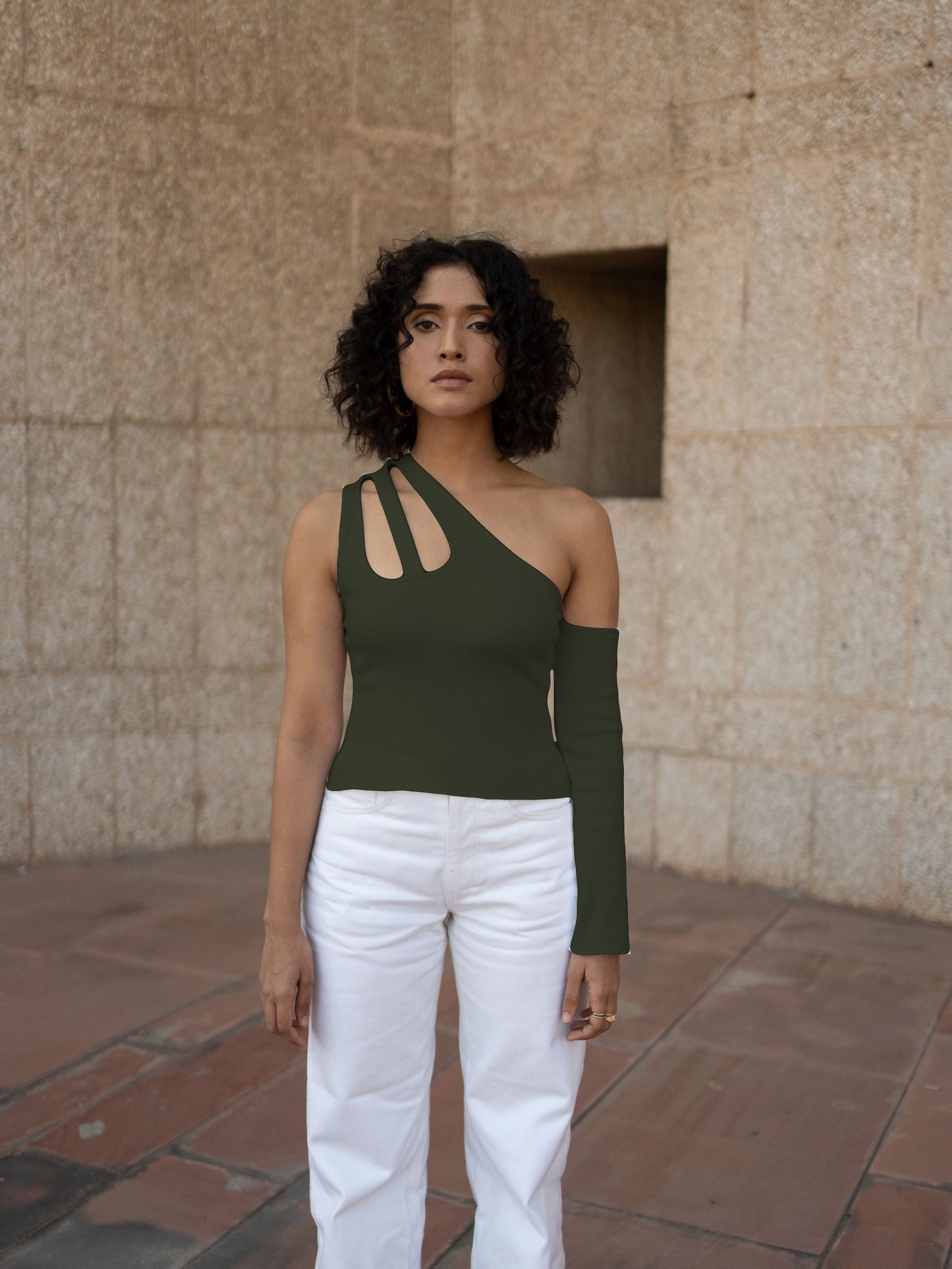 Olive Green Sleeveless Top at Kamakhyaa by Meko Studio. This item is Cotton, Evening Wear, July Sale, July Sale 2023, Lycra, Olive Green, One Shoulder Tops, Sleeveless Tops, Slim Fit, Solids, Sourced from dead stock yarns, Tops, Tranquil AW-22/23, Womenswear