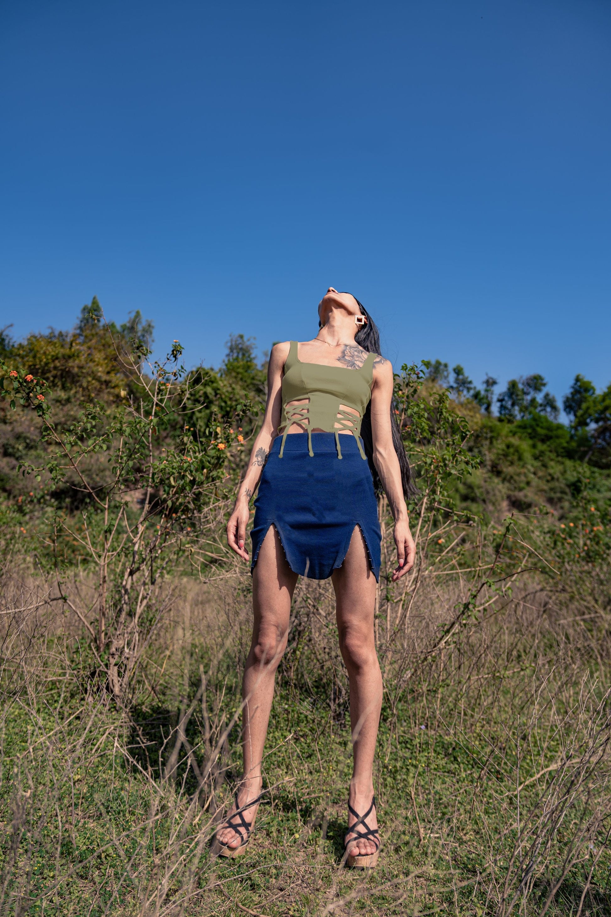 Olive Green Solid Sleeveless Top at Kamakhyaa by Meko Studio. This item is Cotton, Deadstock Fabrics, Fusion Wear, July Sale, July Sale 2023, Olive Green, Sleeveless Tops, Slim Fit, Solids, Spaghettis, Tops, Verao SS-22/23, Womenswear