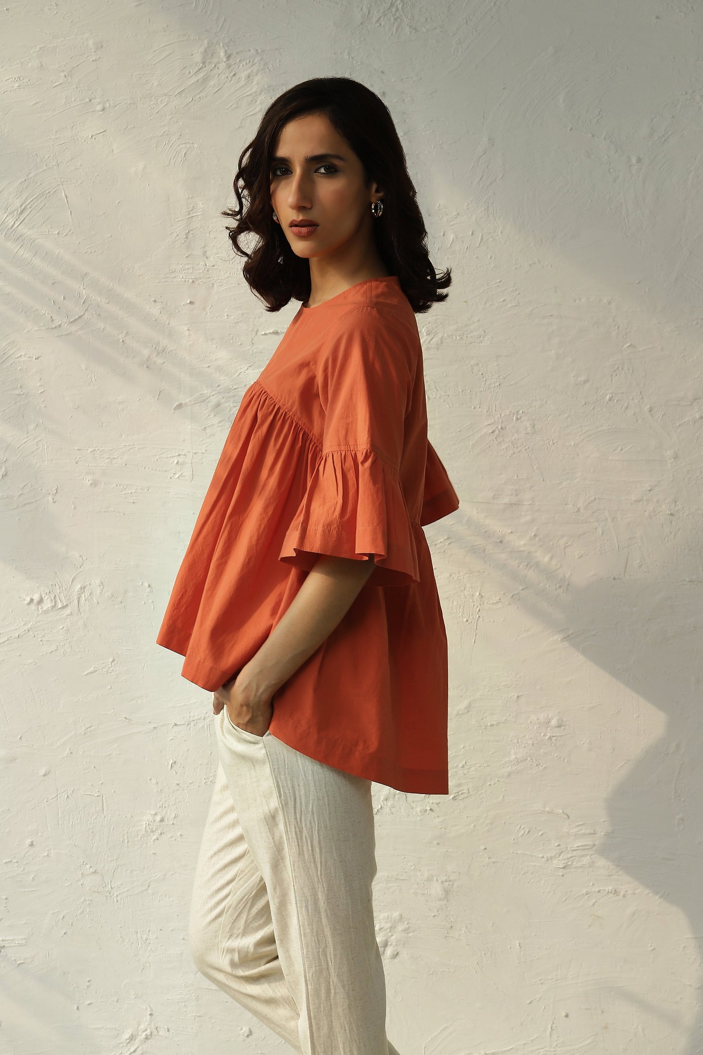 Orange Bell Sleeve Cotton Top Pant Set at Kamakhyaa by Canoopi. This item is Canoopi, Casual Wear, Complete Sets, Natural, Orange, Poplin, Rayon, Regular Fit, Solids, Vacation Co-ords, White, Womenswear