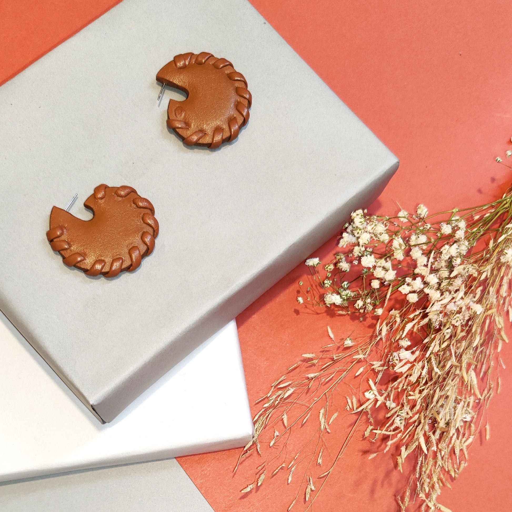 Orange Cirque Studs Earrings at Kamakhyaa by Noupelle. This item is Brown, Casual Wear, Fashion Jewellery, Free Size, jewelry, Less than $50, Natural, Stud Earrings, Upcycled, Upcycled leather