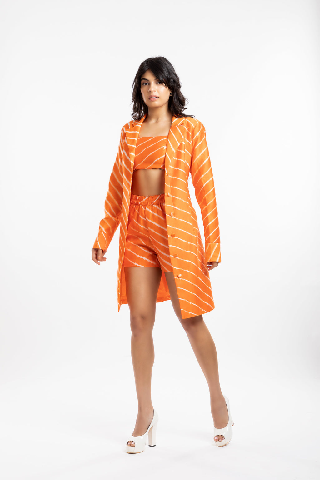 Orange Coat at Kamakhyaa by House Of Ara. This item is Casual Wear, Chanderi, Coats, Cotton, Leheriya, Leheriya Collection, Natural, Orange, Regular Fit, Silk, Stripes, Womenswear