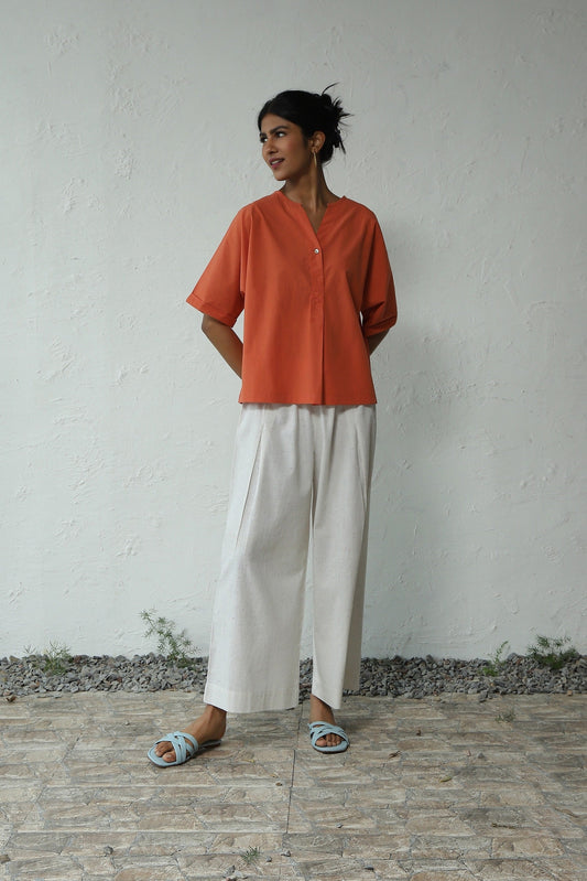 Orange Cotton Shirt With White Khadi Pant Set at Kamakhyaa by Canoopi. This item is Canoopi, Casual Wear, Complete Sets, Khadi, Natural, Orange, Poplin, Regular Fit, Solids, Vacation Co-ords, White, Womenswear
