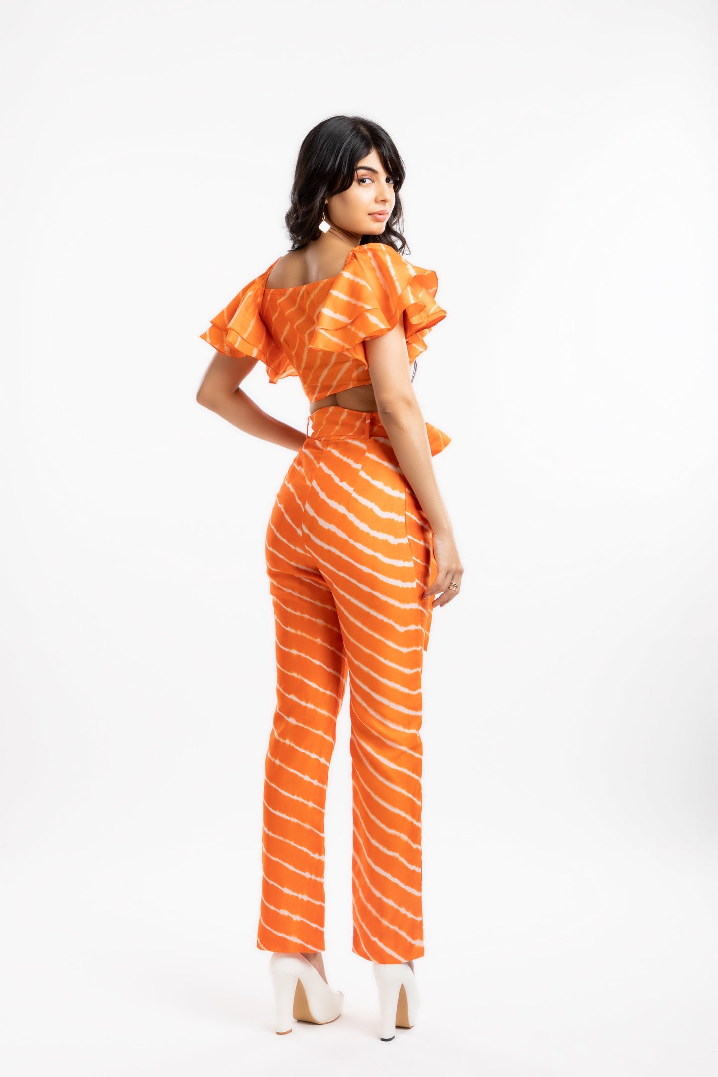 Orange Crop Top with Ruffles at Kamakhyaa by House Of Ara. This item is Casual Wear, Chanderi, Cotton, Crop Tops, Fitted at Bust, Leheriya, Leheriya Collection, Natural, Off-shoulder Tops, Orange, Silk, Stripes, Womenswear