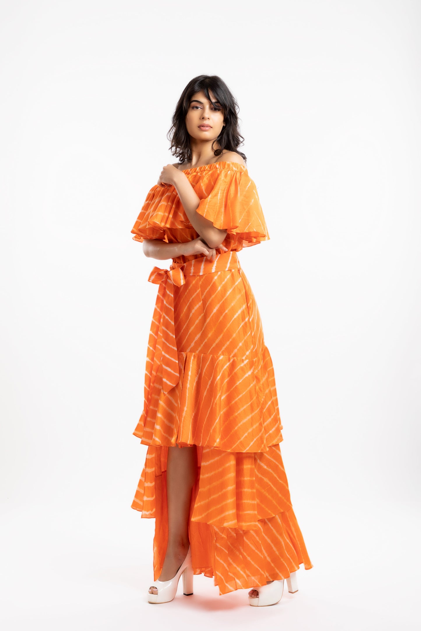 Orange Off-The-Shoulder Top at Kamakhyaa by House Of Ara. This item is Casual Wear, Chanderi, Cotton, Leheriya, Leheriya Collection, Natural, Off-shoulder Tops, Orange, Regular Fit, Shoulder Tops, Stripes, Womenswear