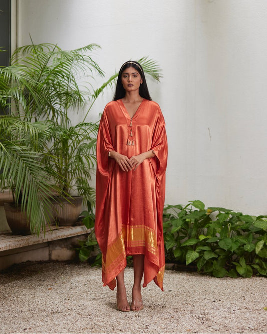 Orange Silk Kaftan With Golden Border at Kamakhyaa by Mayura Kumar. This item is Ajrakh Heritage, Casual Wear, Dresses, Festive Wear, Kaftans, Mayura Kumar, Modal Silk, Relaxed Fit, Solids, Womenswear
