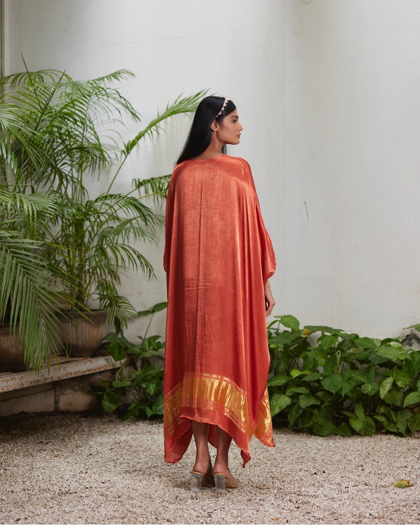 Orange Silk Kaftan With Golden Border at Kamakhyaa by Mayura Kumar. This item is Ajrakh Heritage, Casual Wear, Dresses, Festive Wear, Kaftans, Mayura Kumar, Modal Silk, Relaxed Fit, Solids, Womenswear