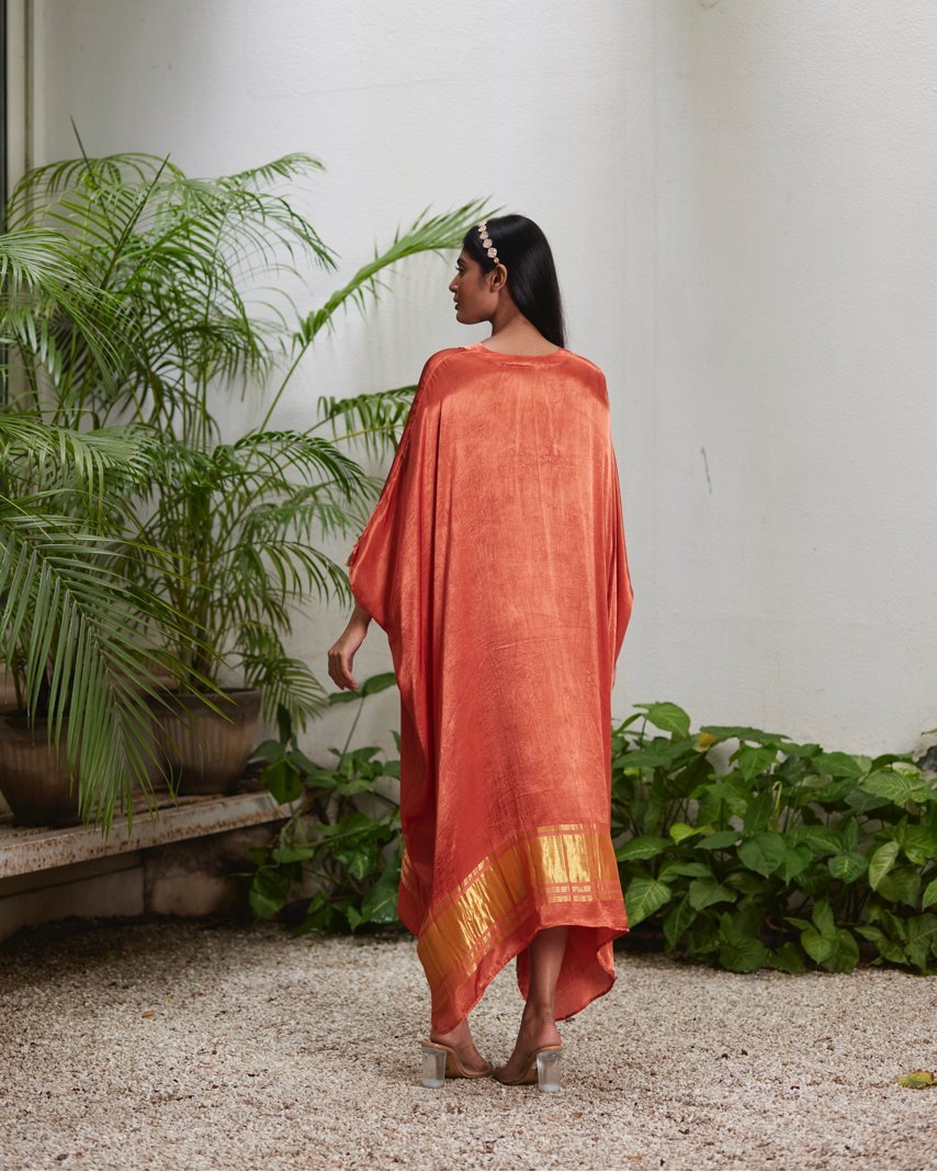 Orange Silk Kaftan With Golden Border at Kamakhyaa by Mayura Kumar. This item is Ajrakh Heritage, Casual Wear, Dresses, Festive Wear, Kaftans, Mayura Kumar, Modal Silk, Relaxed Fit, Solids, Womenswear