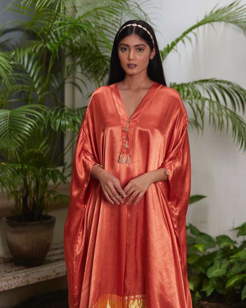 Orange Silk Kaftan With Golden Border at Kamakhyaa by Mayura Kumar. This item is Ajrakh Heritage, Casual Wear, Dresses, Festive Wear, Kaftans, Mayura Kumar, Modal Silk, Relaxed Fit, Solids, Womenswear