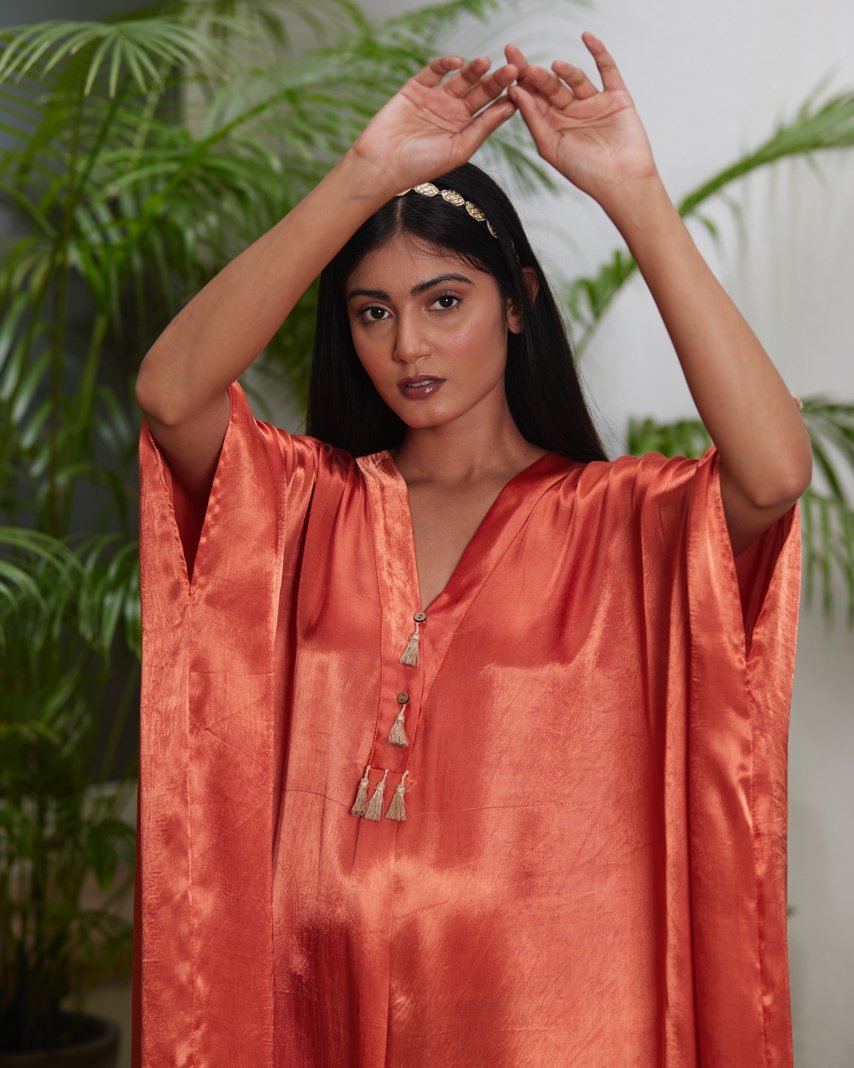 Orange Silk Kaftan With Golden Border at Kamakhyaa by Mayura Kumar. This item is Ajrakh Heritage, Casual Wear, Dresses, Festive Wear, Kaftans, Mayura Kumar, Modal Silk, Relaxed Fit, Solids, Womenswear