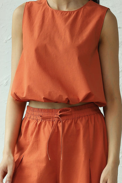 Orange Sleeveless Cotton Co-Ord Set at Kamakhyaa by Canoopi. This item is Canoopi, Casual Wear, Complete Sets, Natural, Orange, Poplin, Regular Fit, Solids, Vacation Co-ords, Womenswear