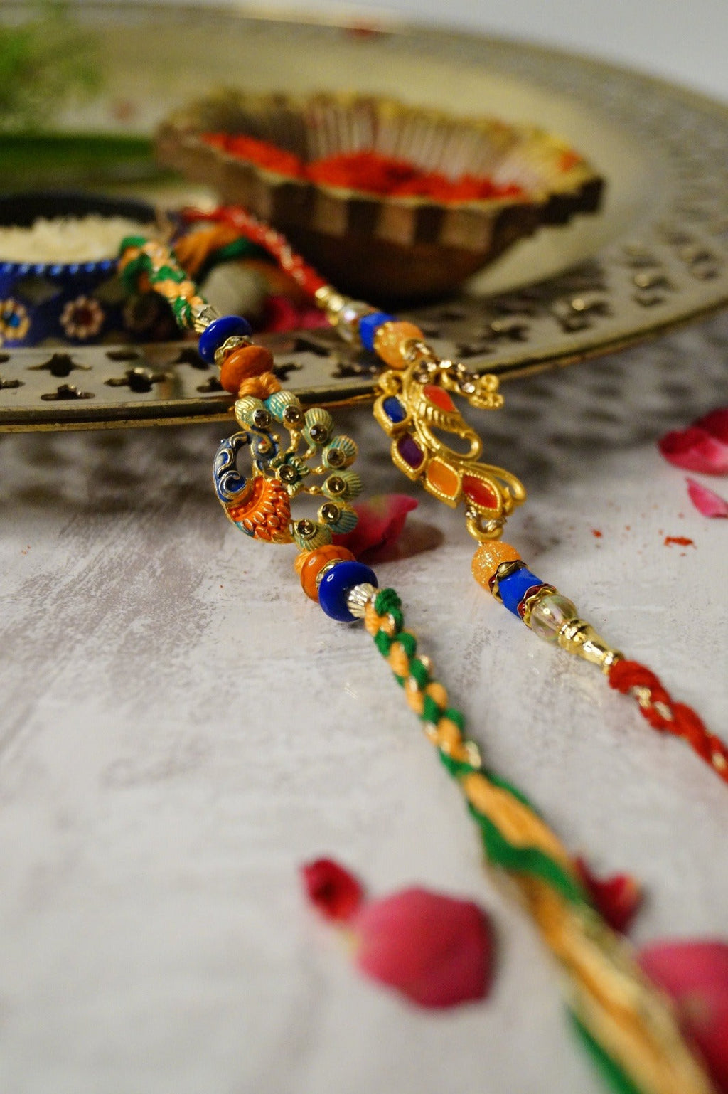 Peacock Stone and Colorful Stone Thread Rakhi at Kamakhyaa by Kamakhyaa. This item is jewelry, Multicolor, Natural, Rakhi, Under 1500, Under 1750, Upcycled