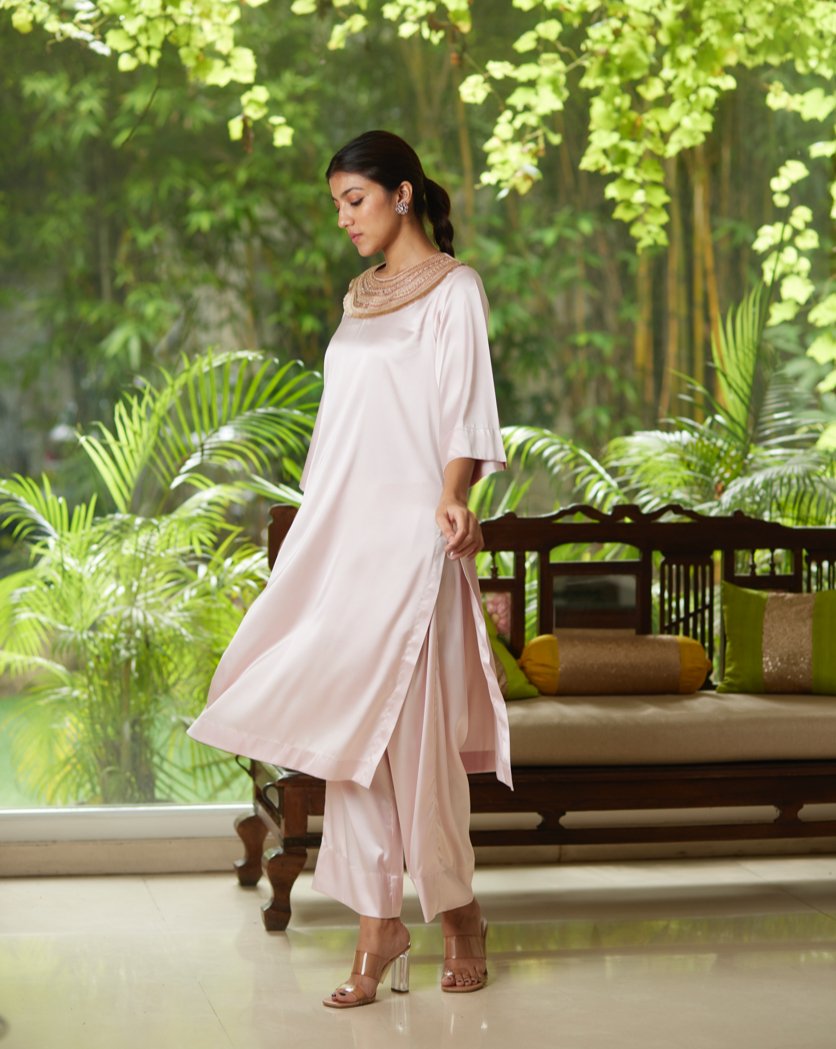 Pink Satin Silk Kurta Pant Set at Kamakhyaa by Mayura Kumar. This item is Casual Wear, Festive Wear, Kurta Pant Sets, Mayura Kumar, Pink, Regular Fit, Satin, Silk, Solids, Timeless Elegance, Womenswear