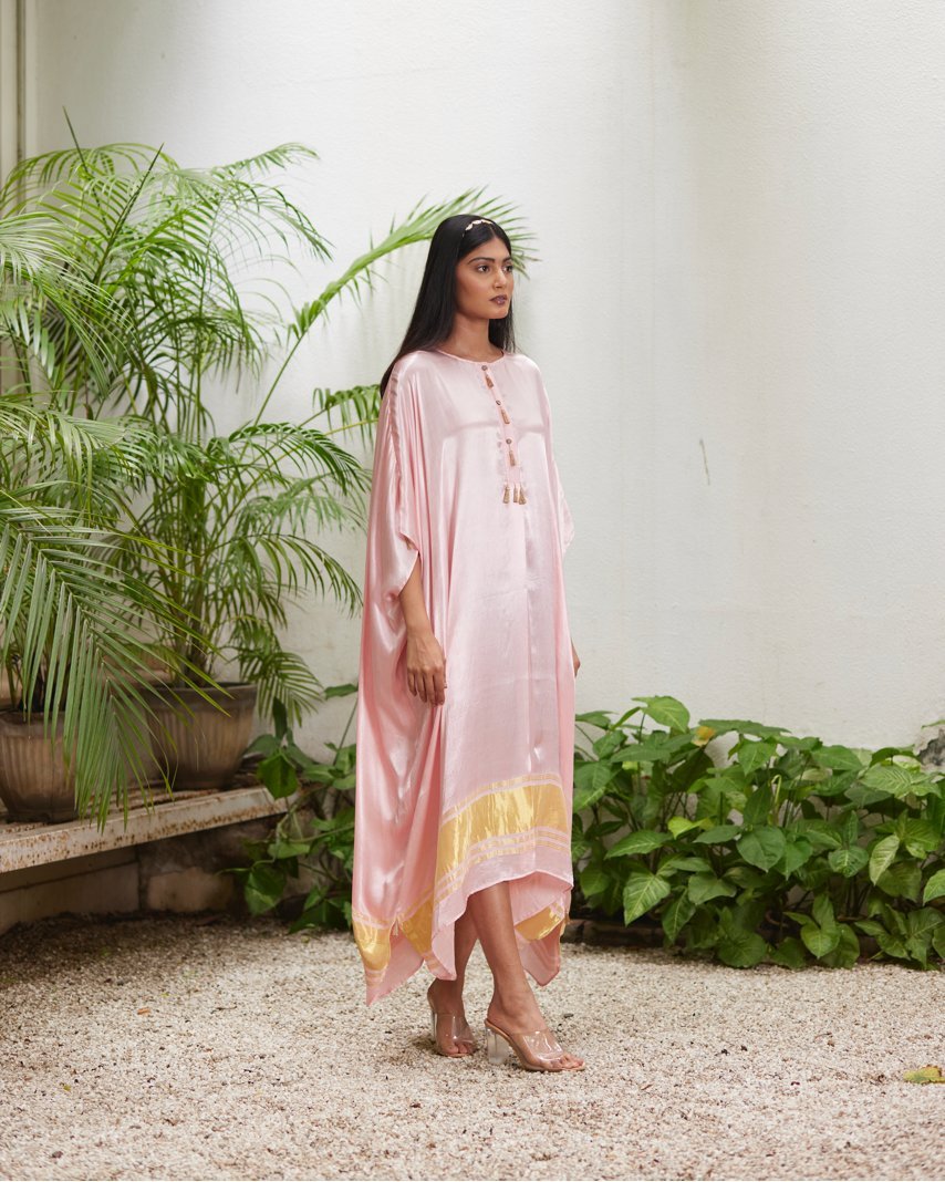 Pink Silk Kaftan With Golden Border at Kamakhyaa by Mayura Kumar. This item is Ajrakh Heritage, Casual Wear, Dresses, Festive Wear, Kaftans, Mayura Kumar, Modal Silk, Relaxed Fit, Solids, Womenswear