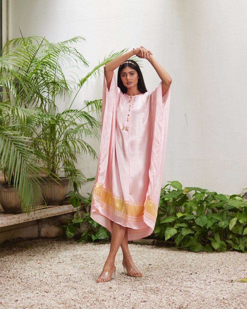 Pink Silk Kaftan With Golden Border at Kamakhyaa by Mayura Kumar. This item is Ajrakh Heritage, Casual Wear, Dresses, Festive Wear, Kaftans, Mayura Kumar, Modal Silk, Relaxed Fit, Solids, Womenswear