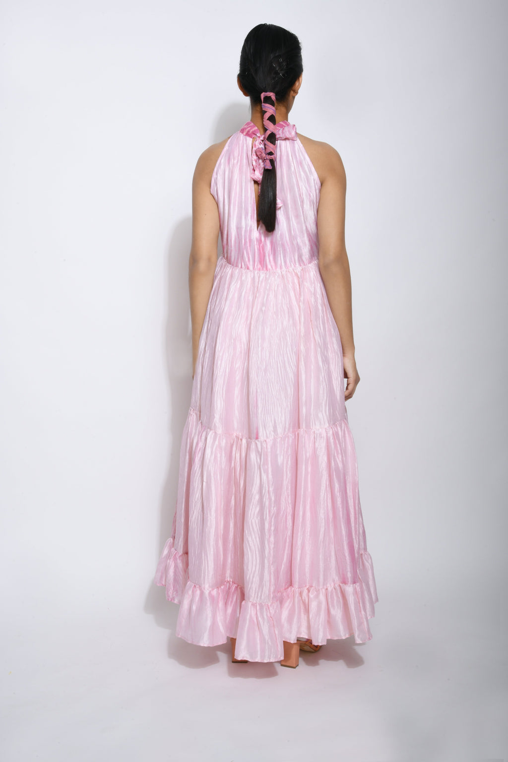 Pink Tiered Dress at Kamakhyaa by The Loom Art. This item is Between the Lines, Halter Neck Dresses, July Sale, July Sale 2023, Maxi Dresses, Natural, Party Wear, Pink, Regular Fit, Silk, Tiered Dresses, Womenswear