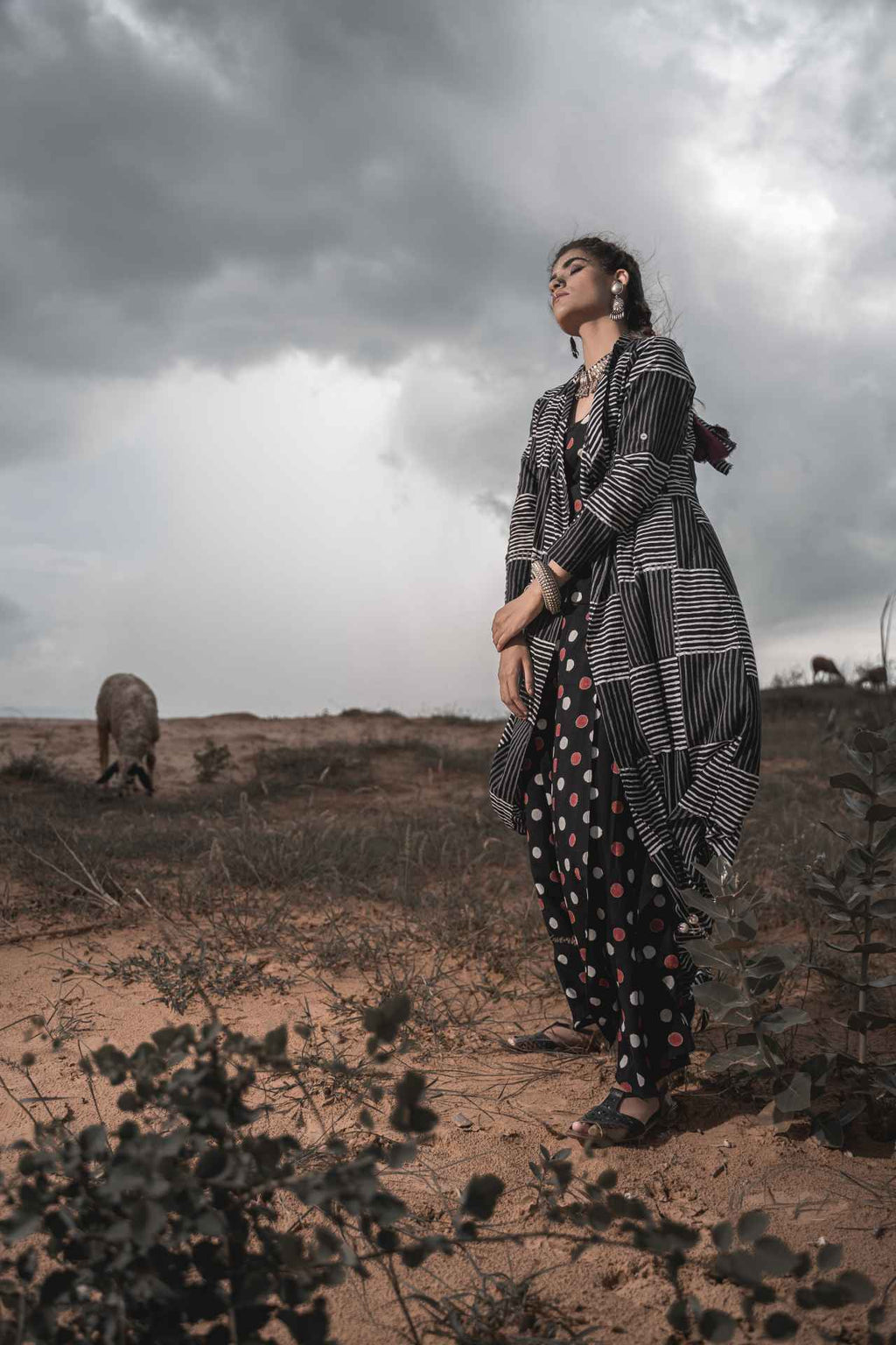 Printed Cotton Top With Asymmetric Cape And Palazzo - Set Of 3 at Kamakhyaa by Keva. This item is Black, Block Prints, Cape, Co-ord Sets, Cotton, Natural, Relaxed Fit, Resort Wear, Vacation, Vacation Co-ords, Wild Child, Womenswear