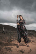 Printed Cotton Top With Asymmetric Cape And Palazzo - Set Of 3 at Kamakhyaa by Keva. This item is Black, Block Prints, Cape, Co-ord Sets, Cotton, Natural, Relaxed Fit, Resort Wear, Vacation, Vacation Co-ords, Wild Child, Womenswear