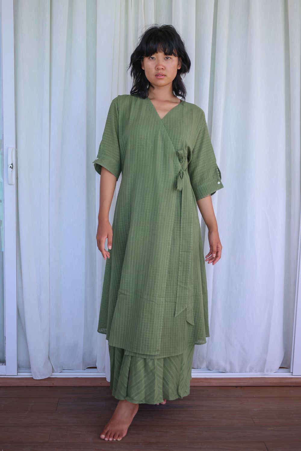 Recycled Cotton Green Solid Midi Dress at Kamakhyaa by Raas. This item is Azo Free Dyes, Casual Wear, Cotton, Green, Layla, Midi Dresses, Recycled, Relaxed Fit, Solids, Womenswear, Wrap Dresses