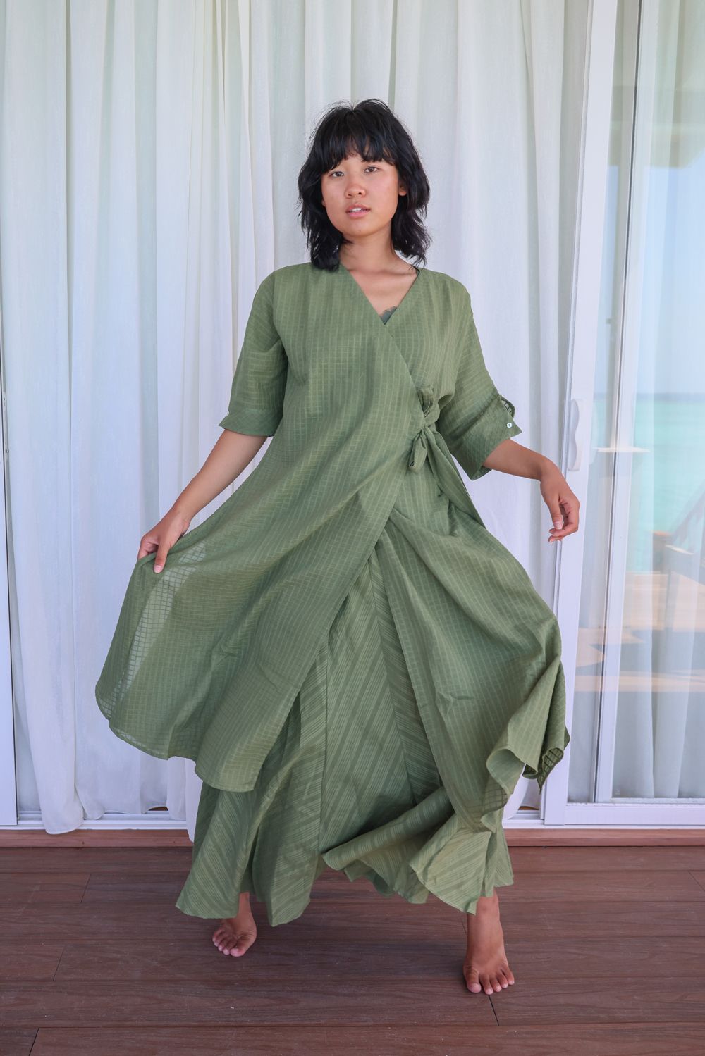 Recycled Cotton Green Solid Midi Dress at Kamakhyaa by Raas. This item is Azo Free Dyes, Casual Wear, Cotton, Green, Layla, Midi Dresses, Recycled, Relaxed Fit, Solids, Womenswear, Wrap Dresses