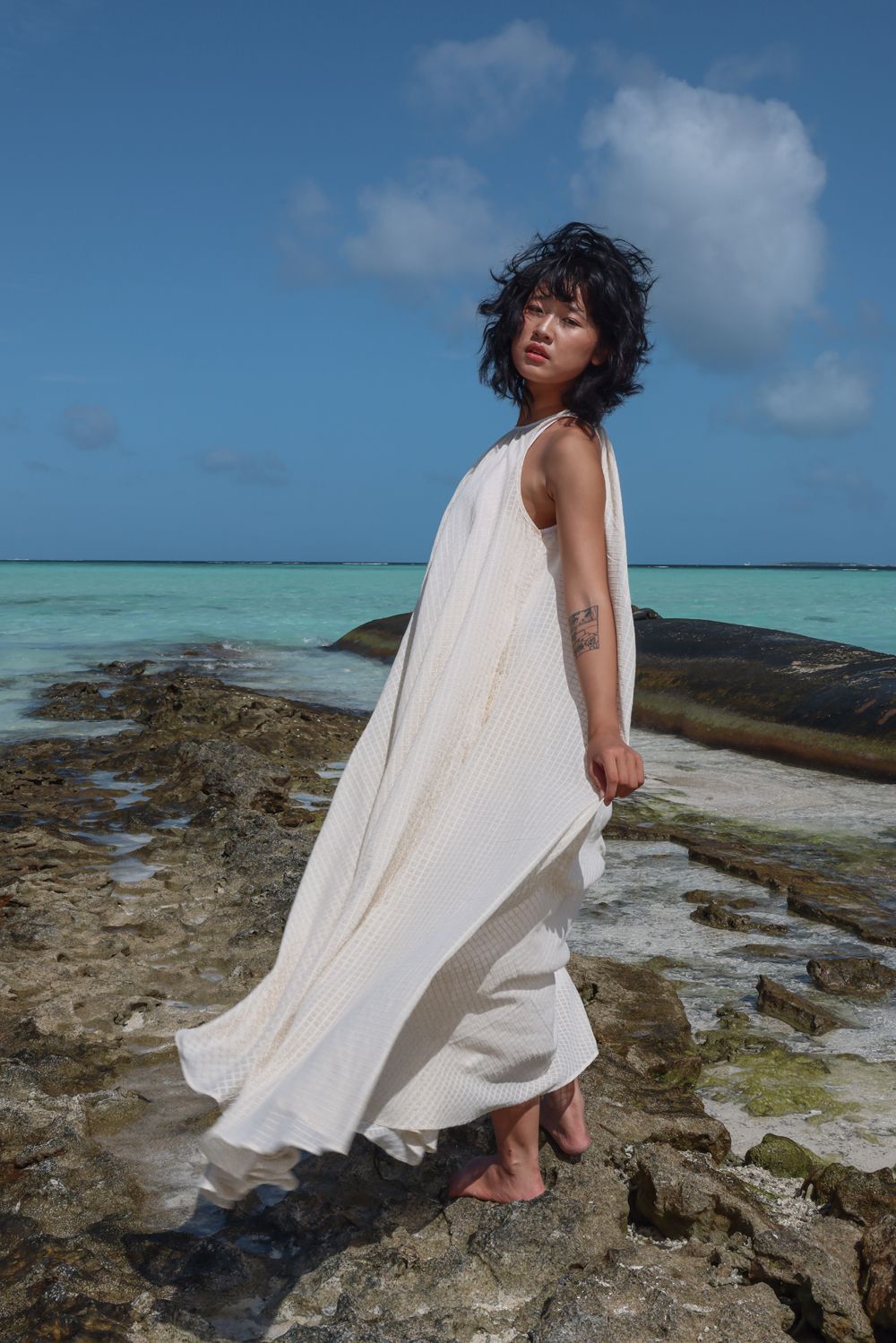 Recycled Cotton Off-White Sleeveless Dress at Kamakhyaa by Raas. This item is Azo Free Dyes, Cotton, Halter Neck Dresses, Layla, Maxi Dresses, Off-White, Recycled, Relaxed Fit, Resort Wear, Sleeveless Dresses, Solids, Womenswear