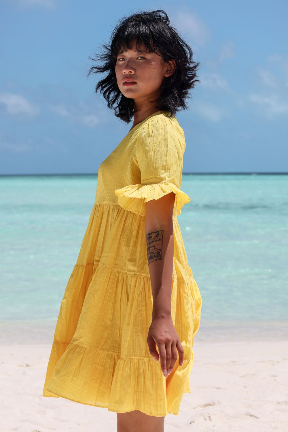 Recycled Cotton Yellow Tiered Dress at Kamakhyaa by Raas. This item is Azo Free Dyes, Cotton, Layla, Mini Dresses, Recycled, Relaxed Fit, Resort Wear, Solids, Tiered Dresses, Womenswear, Yellow