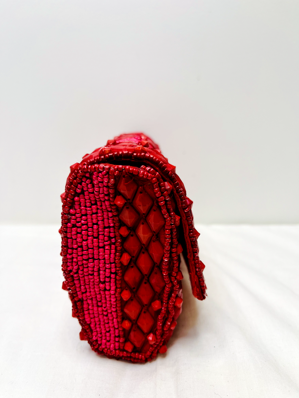 Red Beaded Sling Bag at Kamakhyaa by Pre Loved. This item is Bags, Casual Wear, Mirror Work, Multicolor, Natural, Sling Bags