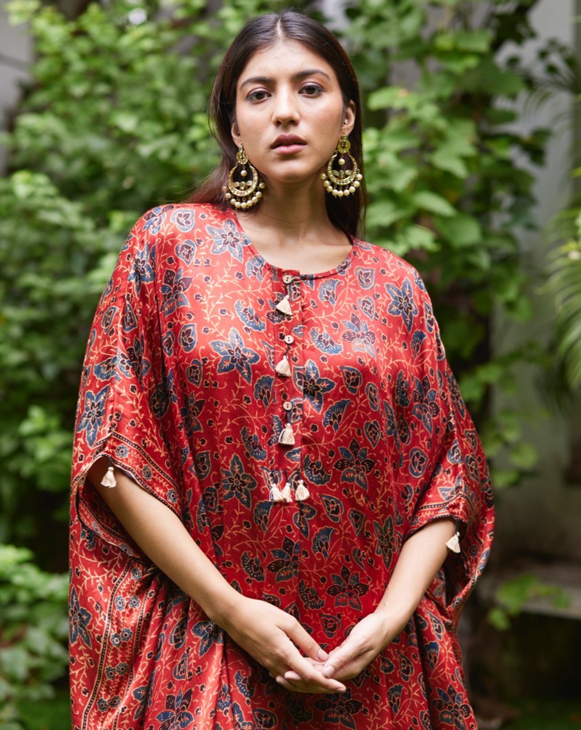 Red Floral Printed Silk Kaftan at Kamakhyaa by Mayura Kumar. This item is Ajrakh Heritage, Casual Wear, Dresses, Festive Wear, Kaftans, Mayura Kumar, Modal Silk, Prints, Red, Relaxed Fit, Womenswear