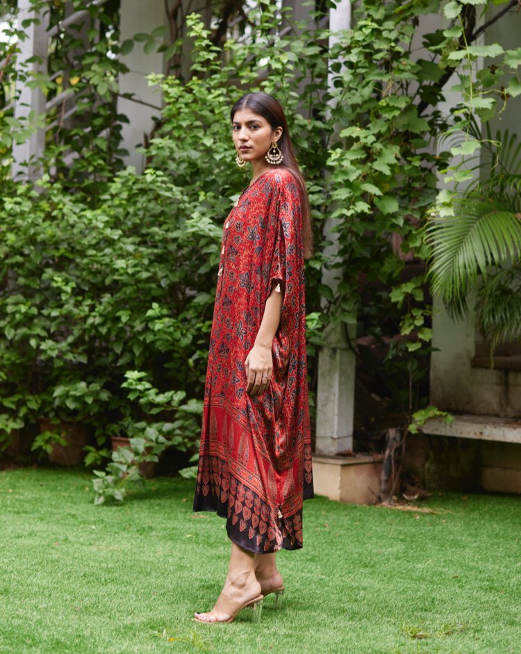 Red Floral Printed Silk Kaftan at Kamakhyaa by Mayura Kumar. This item is Ajrakh Heritage, Casual Wear, Dresses, Festive Wear, Kaftans, Mayura Kumar, Modal Silk, Prints, Red, Relaxed Fit, Womenswear