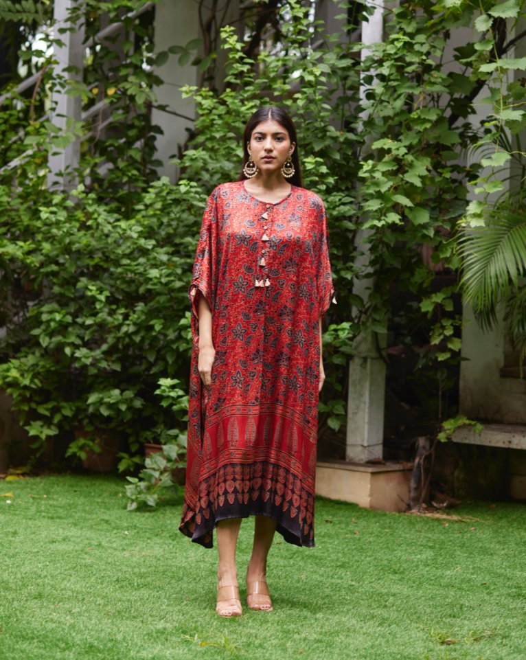 Red Floral Printed Silk Kaftan at Kamakhyaa by Mayura Kumar. This item is Ajrakh Heritage, Casual Wear, Dresses, Festive Wear, Kaftans, Mayura Kumar, Modal Silk, Prints, Red, Relaxed Fit, Womenswear