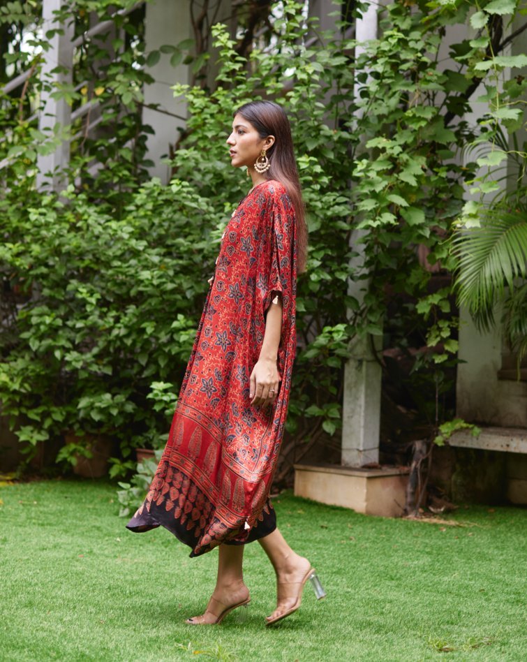 Red Floral Printed Silk Kaftan at Kamakhyaa by Mayura Kumar. This item is Ajrakh Heritage, Casual Wear, Dresses, Festive Wear, Kaftans, Mayura Kumar, Modal Silk, Prints, Red, Relaxed Fit, Womenswear