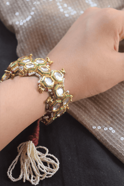 Red Honeycomb Pochi Bracelet at Kamakhyaa by House Of Heer. This item is Alloy Metal, Bracelets, Festive Wear, Free Size, jewelry, Multicolor, Natural, rakhis & lumbas, Textured