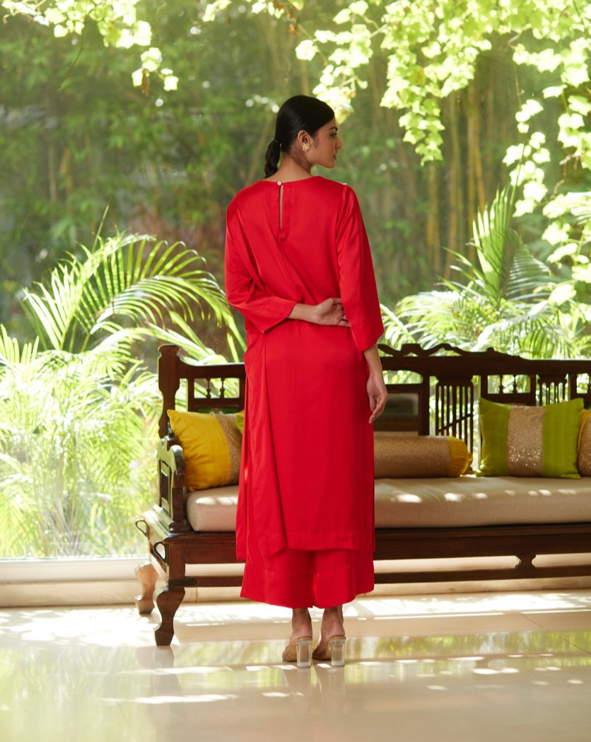 Red Satin Silk Kurta Pant Set at Kamakhyaa by Mayura Kumar. This item is Casual Wear, Festive Wear, Kurta Pant Sets, Mayura Kumar, Red, Regular Fit, Satin, Silk, Solids, Timeless Elegance, Womenswear