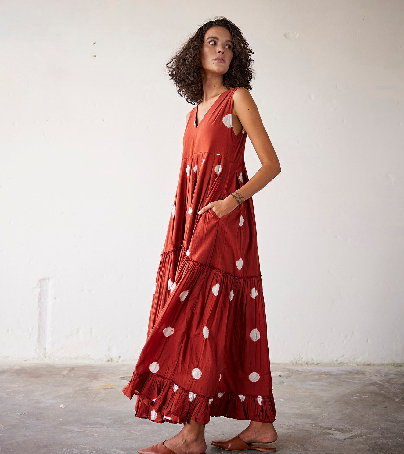 Red Shibori Printed Tiered Maxi Dress at Kamakhyaa by Khara Kapas. This item is An Indian Summer, Casual Wear, Maxi Dresses, Mul-Cotton, Ombres & Dyes, Organic, Red, Relaxed Fit, Womenswear