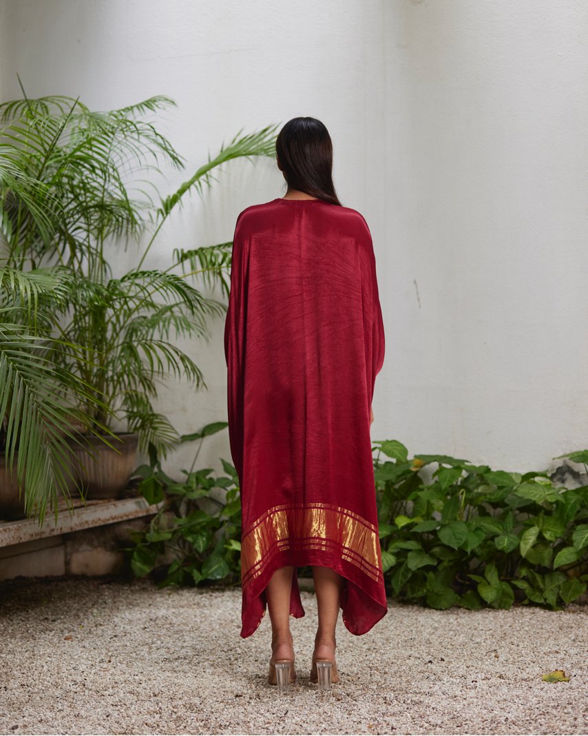 Red Silk Kaftan With Golden Border at Kamakhyaa by Mayura Kumar. This item is Ajrakh Heritage, Casual Wear, Dresses, Festive Wear, Kaftans, Mayura Kumar, Modal Silk, Red, Relaxed Fit, Solids, Womenswear