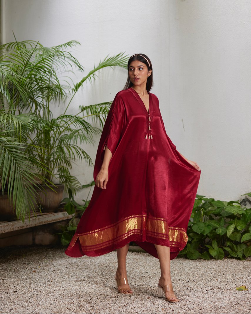 Red Silk Kaftan With Golden Border at Kamakhyaa by Mayura Kumar. This item is Ajrakh Heritage, Casual Wear, Dresses, Festive Wear, Kaftans, Mayura Kumar, Modal Silk, Red, Relaxed Fit, Solids, Womenswear
