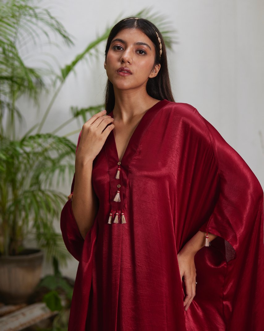 Red Silk Kaftan With Golden Border at Kamakhyaa by Mayura Kumar. This item is Ajrakh Heritage, Casual Wear, Dresses, Festive Wear, Kaftans, Mayura Kumar, Modal Silk, Red, Relaxed Fit, Solids, Womenswear