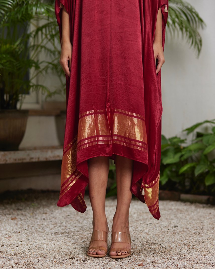Red Silk Kaftan With Golden Border at Kamakhyaa by Mayura Kumar. This item is Ajrakh Heritage, Casual Wear, Dresses, Festive Wear, Kaftans, Mayura Kumar, Modal Silk, Red, Relaxed Fit, Solids, Womenswear