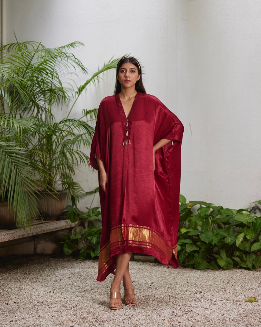 Red Silk Kaftan With Golden Border at Kamakhyaa by Mayura Kumar. This item is Ajrakh Heritage, Casual Wear, Dresses, Festive Wear, Kaftans, Mayura Kumar, Modal Silk, Red, Relaxed Fit, Solids, Womenswear