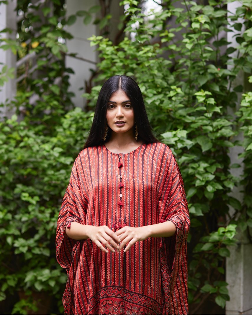 Red Striped Silk Kaftan at Kamakhyaa by Mayura Kumar. This item is Ajrakh Heritage, Casual Wear, Dresses, Festive Wear, Kaftans, Mayura Kumar, Natural, Prints, Red, Relaxed Fit, Stripes, Womenswear